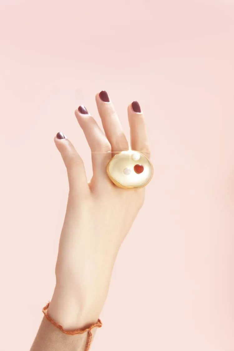 gold cocktail ring with stones